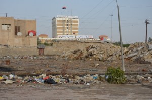 The new Iraq: an oil company building overlooks poverty-stricken slum in Basra...